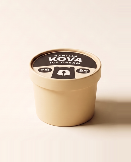 A single-serve cup of Kova vanilla protein ice cream facing forward on a cream background