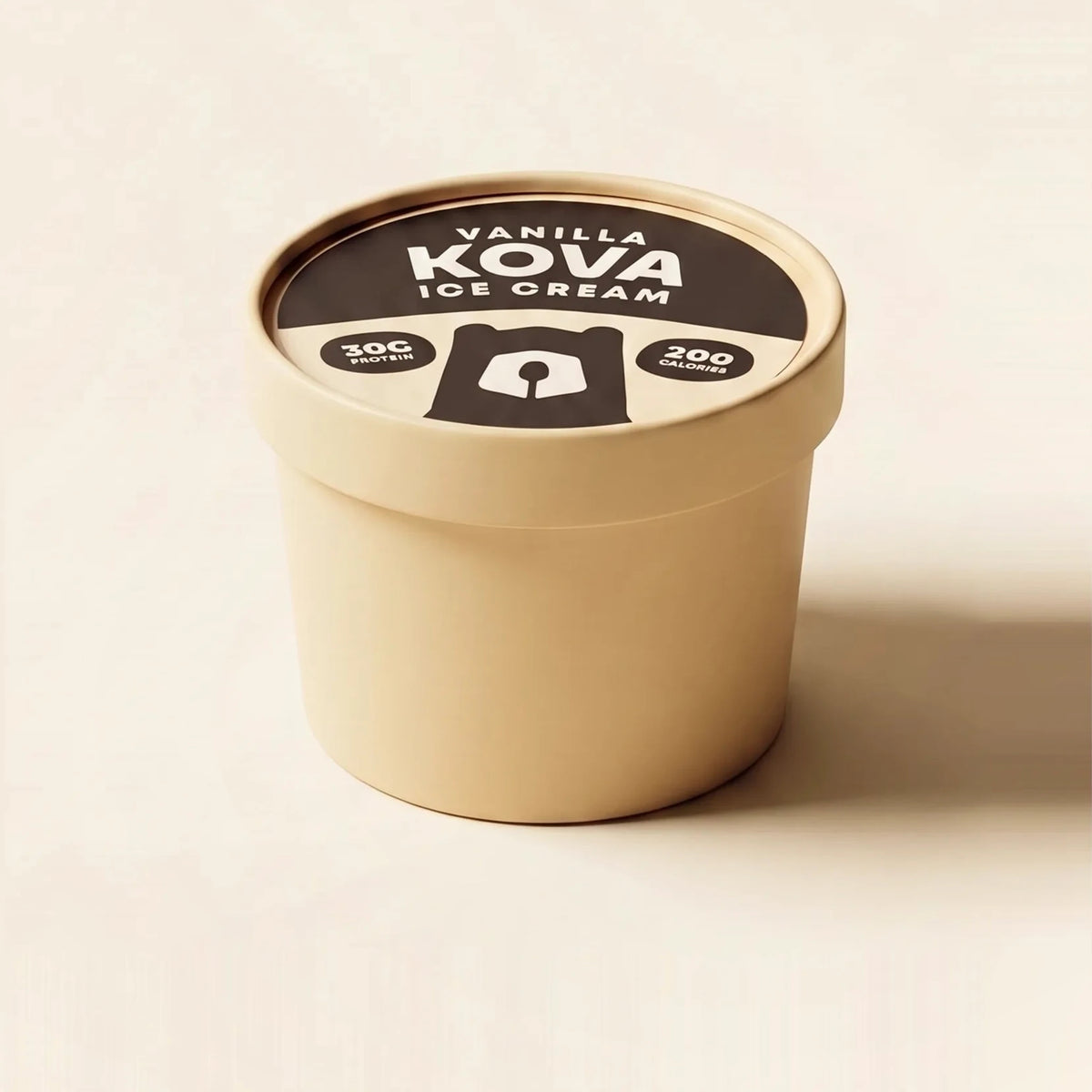 A single-serve cup of Kova Vanilla protein ice cream facing forward on a cream background